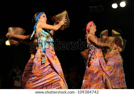 ASSEMINI, SARDINIA - AUGUST 1: A folklore dancing group from Columbia, performs during the International Folk Festival Is Pariglias 2012, on August 1, 2012 in Assemini, Sardinia.