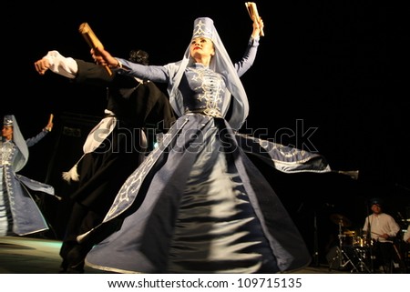 ASSEMINI, SARDINIA - AUGUST 1: A folklore dancing group from Russia, performs during the International Folk Festival Is Pariglias 2012, on August 1, 2012 in Assemini, Sardinia.
