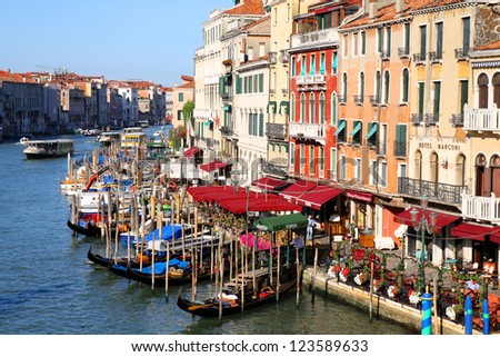 VENICE, ITALY -APRIL 8: Gondolas and tourists on April 8, 2011 in Venice, Italy. Venice has an average of 50,000 tourists a day and was the 26th most visited city in the world.