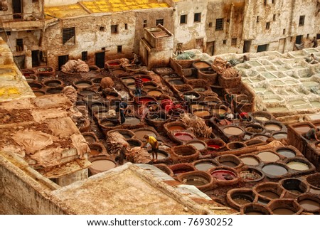 FEZ, MOROCCO - SEPTEMBER 20: People working at the ancient traditional leather tannery on September 20, 2008 in Fez, Morocco.
