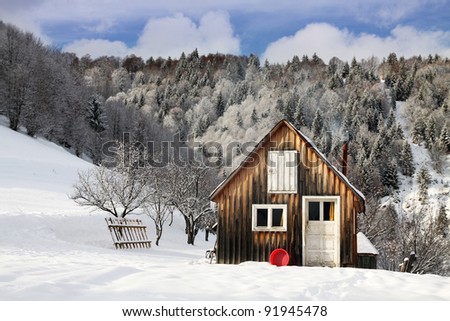 cottage in a beautiful snow forest.