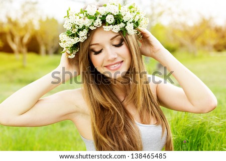 Beautiful Girl In Wreath Of Flowers
