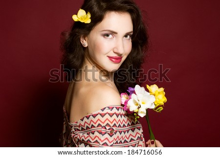 Pretty brunette lady with fresia flowers