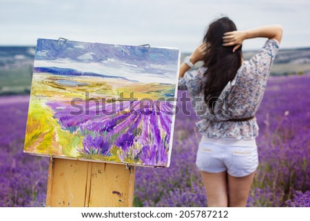 Young artist painting an floral landscape