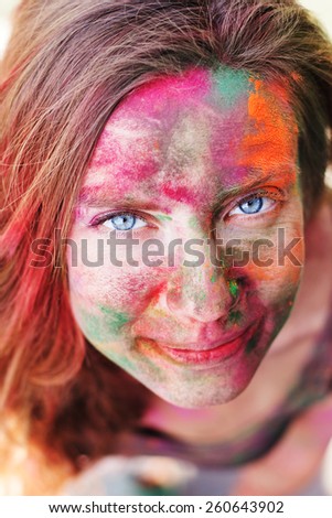 Portrait of an emotional girl with paint on her face, India, Holi festival, Rishikesh