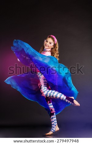 Beautiful belly dancer girl is wearing a colorful fashion costume.