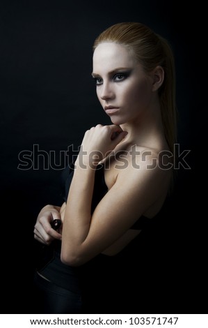 18 years old fashion female model at black background