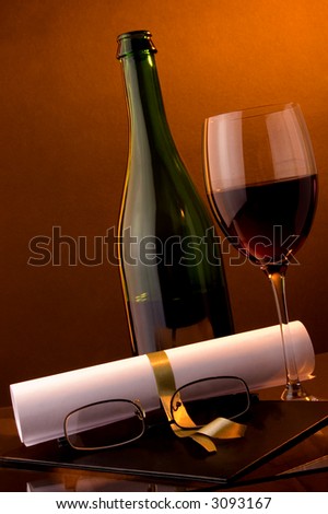 diploma red wine glasses glass and green bottle