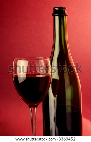 red  sparkling wine glass and bottle