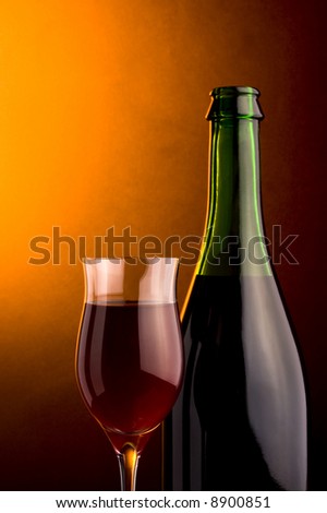 a glass an a bottle of red wine details