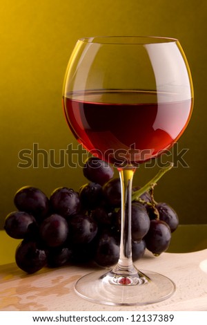 a glass of red wine grape