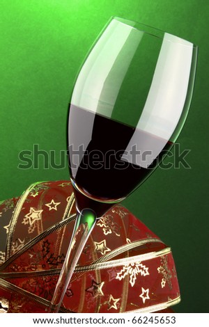 a glass of red wine detail and Christmas decoration
