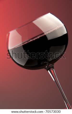 a glass of red wine details