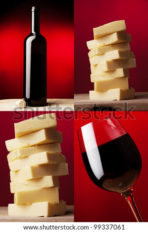 a wine glass with red wine and dark wine bottle  and yellow caw cheese