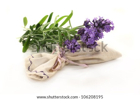 fresh lavender flowers and lavender bag on a white background