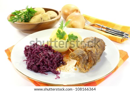 braised beef roll with potatoes and red cabbage