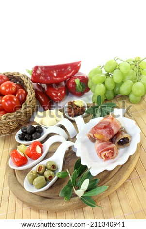 different tapas in Serving spoon on a wooden board