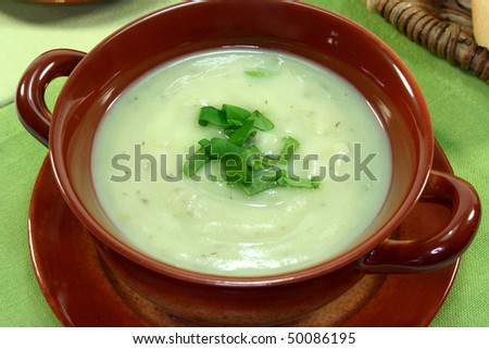Herbal soup garnished with fresh sorrel
