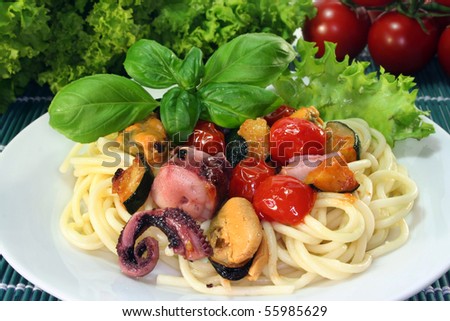 Spaghetti with fried vegetables and seafood