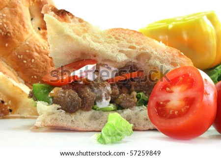 Pita bread filled with onion meat and vegetables