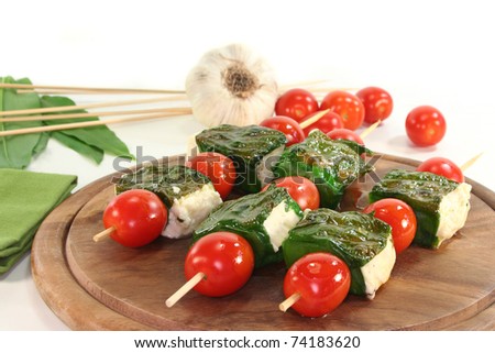 Feta cheese wrapped in wild garlic and cherry tomatoes