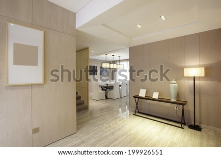 Elegant house interiors,Wide view of home entrance and hallway with dining room in view