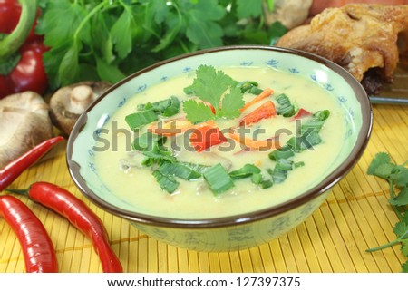 Curry soup with chicken, bell peppers, coconut milk, ginger, carrots and Shiitake mushrooms