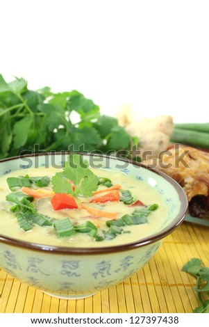 Curry soup with chicken, bell peppers, coconut milk, scallions, carrots and Shiitake mushrooms