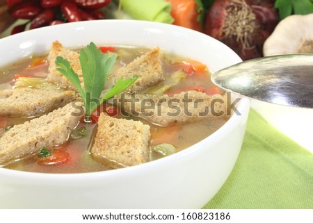 Bread Soup with parsley on a light background