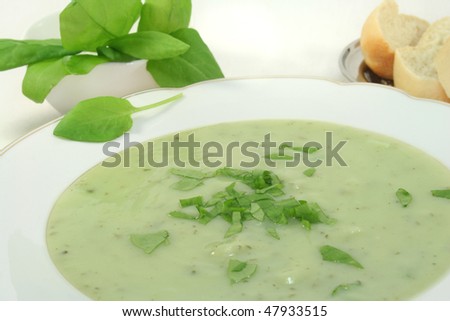 Herbs soup with fresh sorrel and baguette