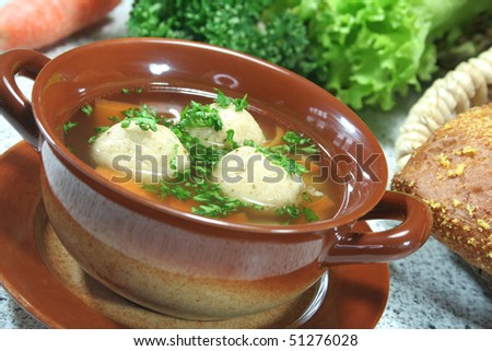 Marrow soup with fresh parsley, vegetables and rolls