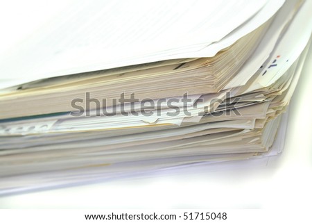 large stack of papers on a white background