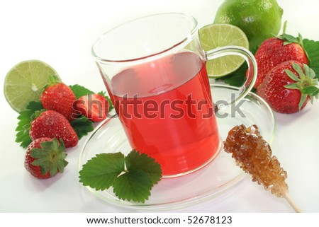Strawberry tea with fresh strawberries and lime