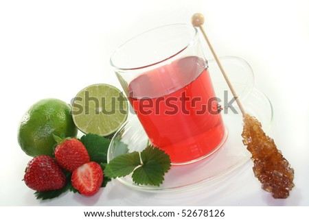 Strawberry tea with fresh strawberries and lime