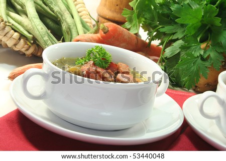 Green bean stew in a white soup cup