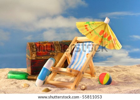 old treasure chest with a bottle post, lounger and toiletries at the beach