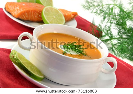 Salmon cream soup with a dollop of cream and dill