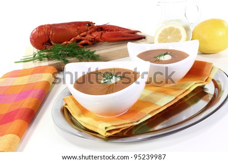 lobster soup with lemon, dill and cream dollop