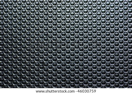 Speaker grille with circle pattern.