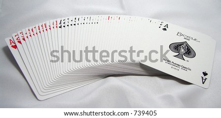 Full Deck of 52 Playing Cards Spread Out on White Background