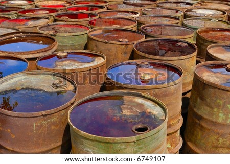 empty rusting chemical barrels