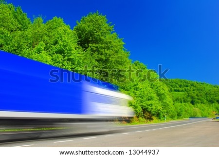 Fast moving heavy truck on the road