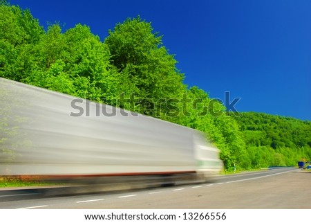 Heavy fast moving truck on the road