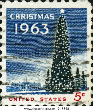 A vintage US potage stamp from 1963 with a christmas tree and white house in the background.