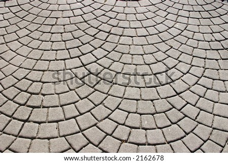 A circular pattern faux cobblestone sidewlk