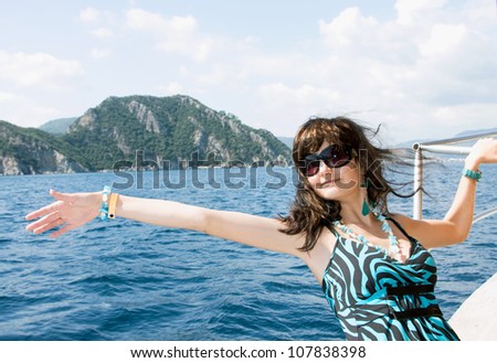 Happy young woman on holidays on the sea