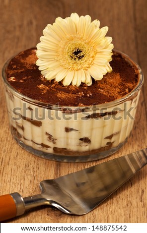 Italian dessert tiramissu of cheese, decorated flower