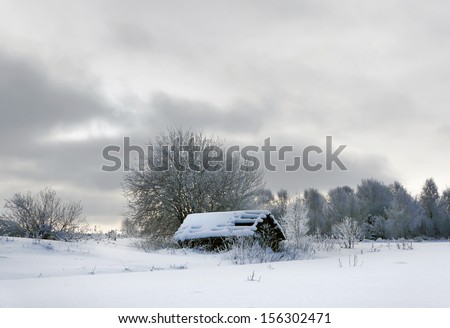 Old wooden house in russian country, winter season