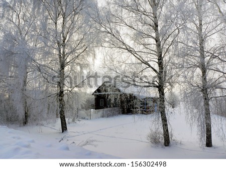 Old wooden house in country, winter season