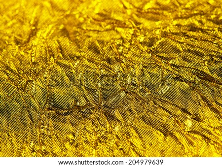 Golden texture, gold foil close up background